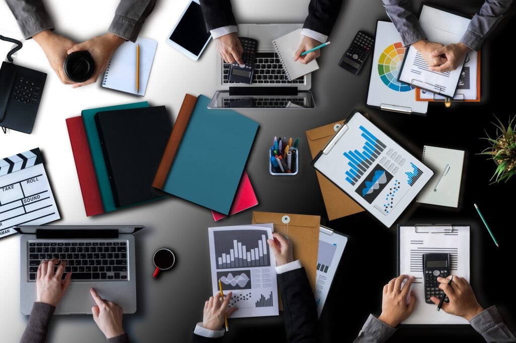 Simplifying Corporate Tax Registration in the UAE: A Guide by Profitrack Accounting 35 businessman-group-of-multiethnic-busy-people-meeting-with-other-in-modern-office-with-laptop
